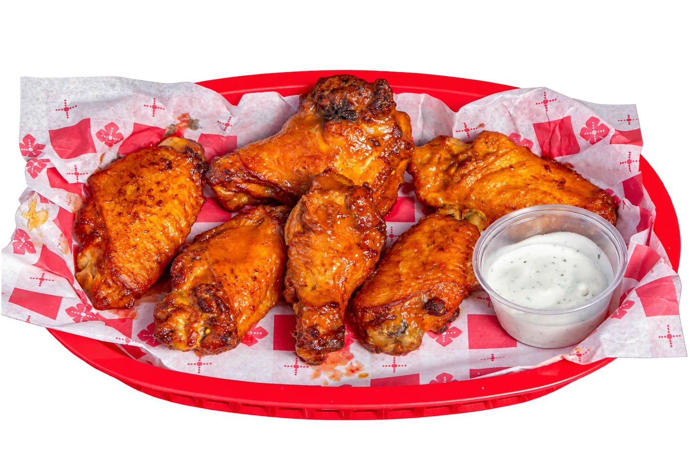 Joe’s Famous Wings with dipping sauce in a red basket